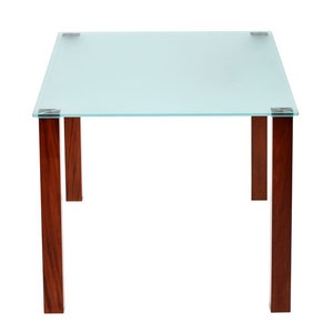 May include: A square glass table top with a frosted finish sits on four dark brown wooden legs. The table is made of clear glass with a frosted finish.