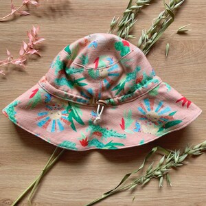 Stay Put Sun Hat Handmade For Baby Girl In Cotton & Linen. Safari Animal Theme Infant Beach Hat For Summer In Pastel Pink. Baby Girl Gift. image 2