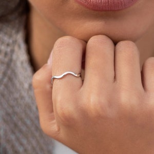 Thin silver ring with waves