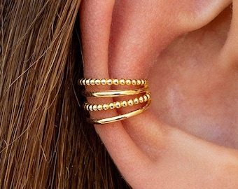 Orecchini ear cuff a conchiglia con 4 fasce a sfera e argento liscio