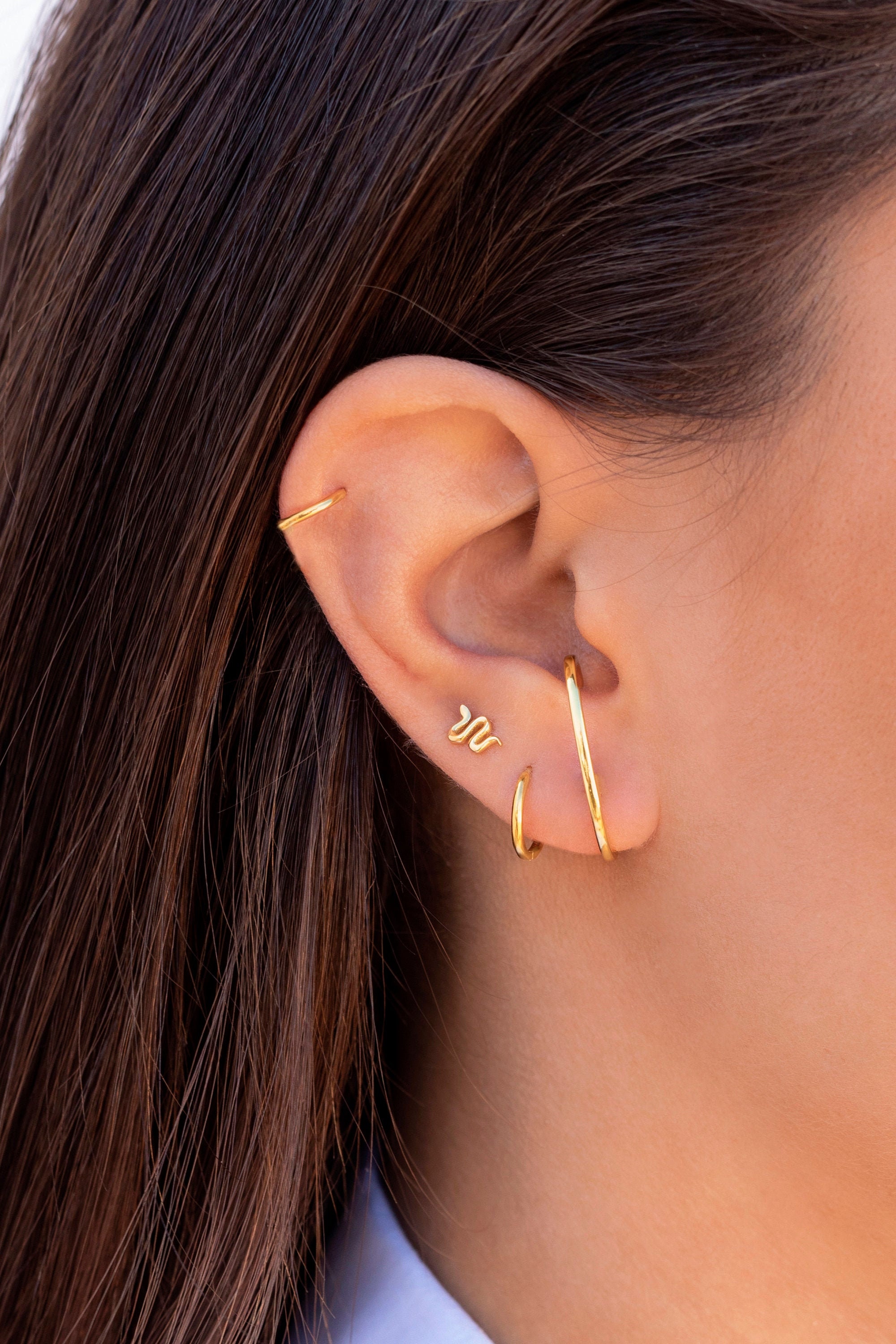 Small snake-shaped stud earrings
