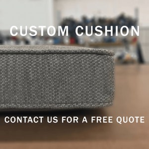 May include: A close-up of a gray custom cushion with a textured fabric. The text "CUSTOM CUSHION" is at the top of the image and the text "CONTACT US FOR A FREE QUOTE" is at the bottom of the image.