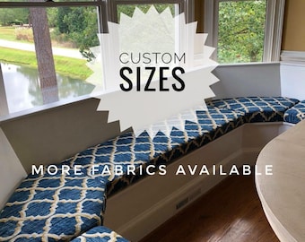 May include: A blue and gold patterned window seat cushion with the text "CUSTOM SIZES" and "MORE FABRICS AVAILABLE".