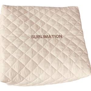 May include: A square, off-white quilted fabric cover featuring a diamond-stitched pattern across its surface. The word SUBLIMATION is embroidered in a dark brown thread in the center of the fabric, providing a clear contrast against the light background.