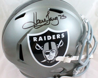 May include: A silver football helmet with a black Raiders logo and the signature "Davey 75" on the side.
