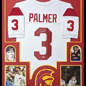 May include: Framed white football jersey with red accents, displaying the name "PALMER" and the number "3." Includes action shots of a football player in a matching uniform, along with a team logo.