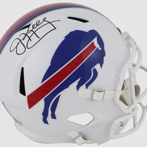 May include: White football helmet with a blue and red Buffalo Bills logo. The helmet is signed "Josh Allen".