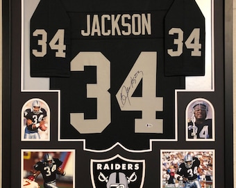May include: Framed black Raiders jersey with the name "JACKSON" and the number "34" in silver. Includes photos of the player in action and the Raiders logo. The jersey is signed.