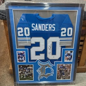Maillot des Lions de Détroit de Barry Sanders dédicacé encadré SCHWARTZ COA