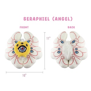 Puede incluir: Almohada de &aacute;ngel de felpa blanca con detalles bordados en rosa y rojo. El &aacute;ngel tiene una cara amarilla con un ojo grande y un coraz&oacute;n. La almohada mide 28 cm de alto y 25 cm de ancho.  SERAPHFIEL (ANGEL) est&aacute; escrito en letras rosas en la parte superior de la imagen.