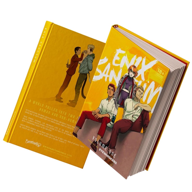 K&ouml;nnte beinhalten: Ein gelber Hardcover-Graphic Novel mit dem Titel "Erik Sanctum: Volume One Eye Whiskers" mit einer 18+ Bewertung. Das Cover zeigt eine Gruppe von Charakteren, darunter eine Frau mit blauen Haaren und ein Mann mit einem wei&szlig;en Hemd und roten Hosen.