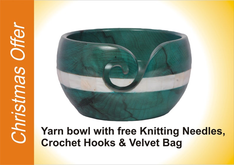 May include: A green wooden yarn bowl with a white inlay and a carved swirl design. The bowl is advertised as coming with free knitting needles, crochet hooks, and a velvet bag.