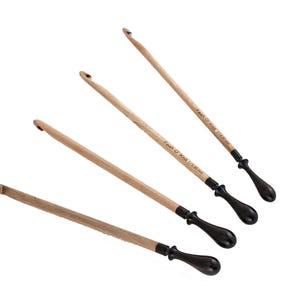 May include: Four wooden crochet hooks with black handles. The hooks are labeled with their sizes: 3.5 mm, 4 mm, 4.5 mm, and 5 mm.