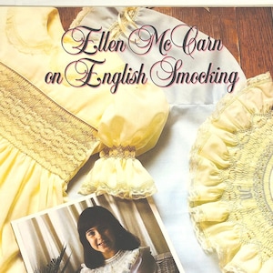 May include: A book cover featuring the title "Ellen McCarn on English Smocking" in elegant script. The cover showcases examples of smocked garments in yellow and white, along with two photographs of children wearing smocked dresses. The overall theme is related to sewing and vintage fashion.