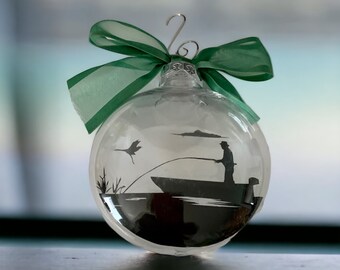 Floating Ornament Fishing Scene - Man fishing as a crane flies in to land - Fisherman Acrylic ornament, disc shaped