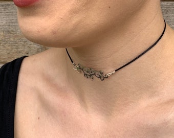 Black cord choker with floral ornament