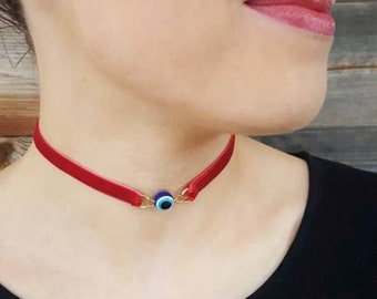 Red velvet choker with blue eye bead. Lucky charm