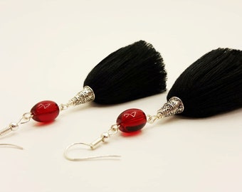 Black tassel earrings with red glass beads