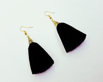 Black tassel earrings with gold tone caps