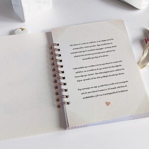 May include: A white spiral bound journal with a pink heart on the cover. The journal has a quote on the first page that reads: "This diary is not a condition, it is a refuge for your thoughts, anxieties, wishes and dreams.  A place where you can share your feelings and make your own journey.  A safe place where you can record and map your progress and discover the marvels that lie in you."