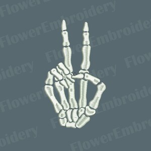 May include: White skeleton hand making the peace sign. The hand is stylized and embroidered.