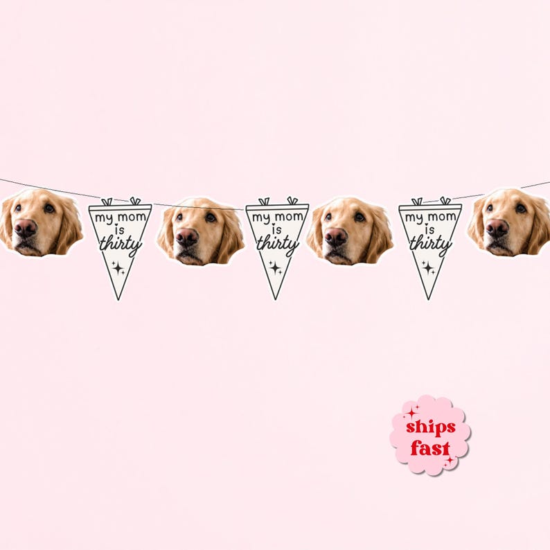 May include: A decorative banner featuring alternating pennants and golden retriever dog faces. The white triangular pennants are printed with black text that reads "my mom is thirty" and include small star icons. The banner is strung on a thin line.