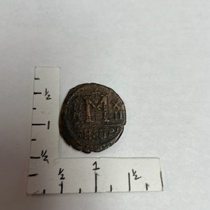 This is a Byzantine Empire  Maurice Tiberius Bronze  Follis Coin Dated from 13 Aug AD - 582- 602