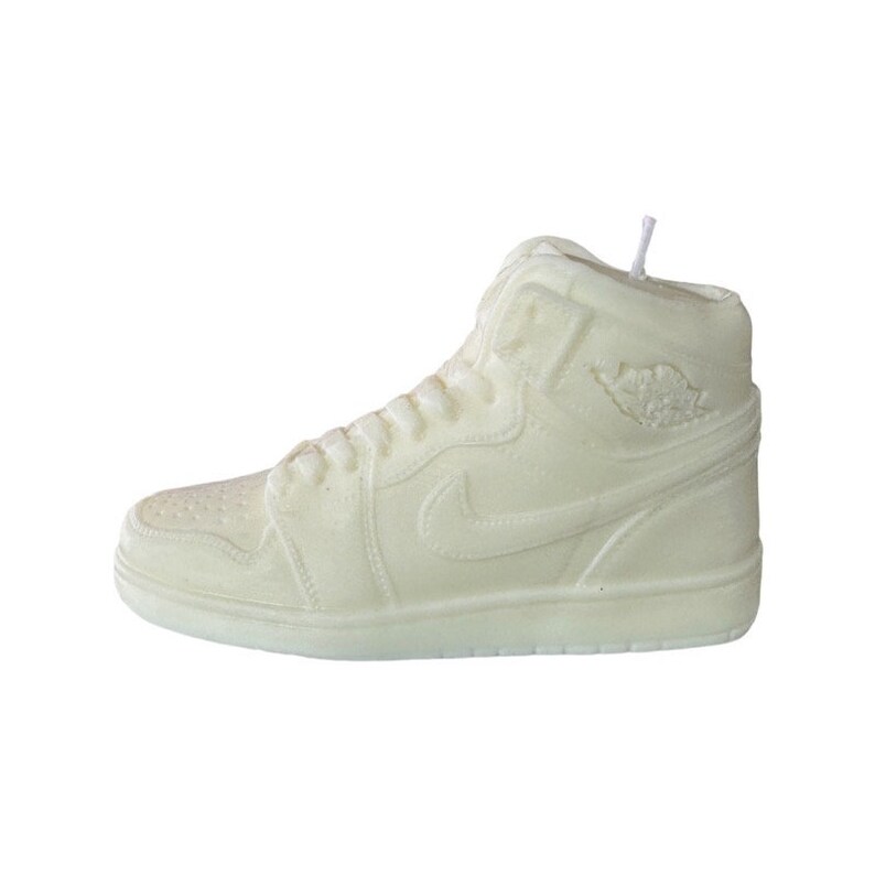 May include: A white sneaker candle with a classic high-top design. The candle features a white swoosh logo and a white sole.