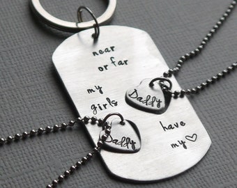 Two heart cut-out dog tag keychain and necklace set