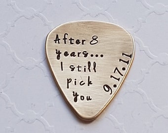 Custom hand-stamped guitar pick