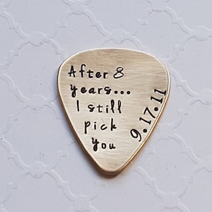 Custom hand-stamped guitar pick