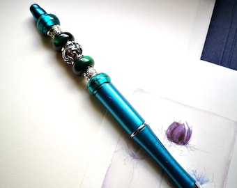 Decorated ballpoint pen, including replacement refill, turquoise