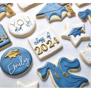These a graduation royal icing sugar cookies are made in the colors of royal blue, white, and gold for the accents, but can be made with any two main colors & and accent color. Each of the 6 different designs will be detailed in the following pictures. The text can be customized
