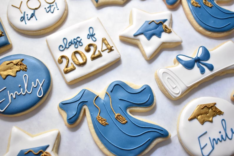 - Royal blue graduation gown cookie with gold cords

- White diploma cookie tied with a royal blue ribbon on top