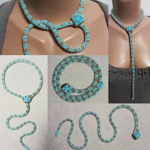May include: A turquoise and gold beaded snake necklace with a snake head clasp. The necklace can be worn as a choker or as a long pendant.