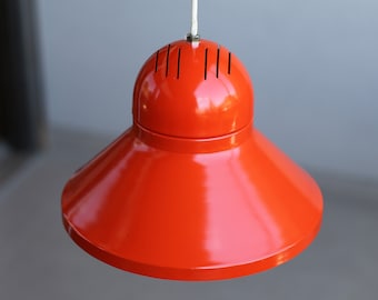 May include: A bright orange pendant light with a wide, rounded shade and a small, round top. The shade has a series of small holes around the top.