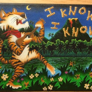 May include: A painting of a tiger playing a ukulele in a jungle setting. The tiger is wearing a red bandana and has a bright orange and black striped pattern. The background is a dark blue sky with a crescent moon and a green jungle with a volcano in the distance. The text "I KNOW, I KNOW" is written in yellow across the top of the painting.
