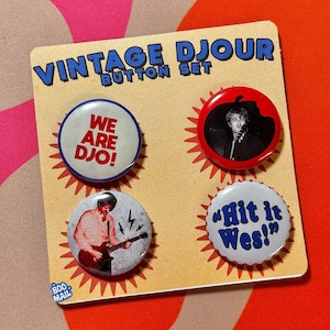 May include: A vintage button set with four circular buttons. The buttons feature text and images, including "WE ARE DJO!" and "Hit it Wes!". The set is on a tan card with the words "VINTAGE DJOUR BUTTON SET".