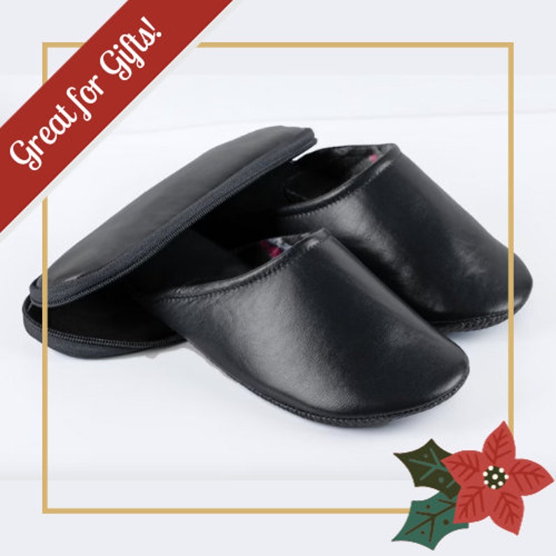 May include: A pair of black leather slippers with a zippered pouch. The slippers have a soft lining and are great for gifts.
