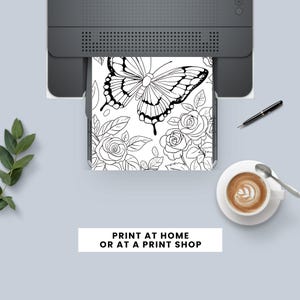 May include: Black and white printable coloring page featuring a butterfly and roses. Print at home or at a print shop.