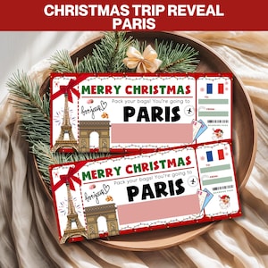 May include: Two Christmas-themed boarding passes reveal a trip to Paris. Each pass features the Eiffel Tower, Arc de Triomphe, and the text "Merry Christmas" and "Paris". The passes are red and white with a bow.