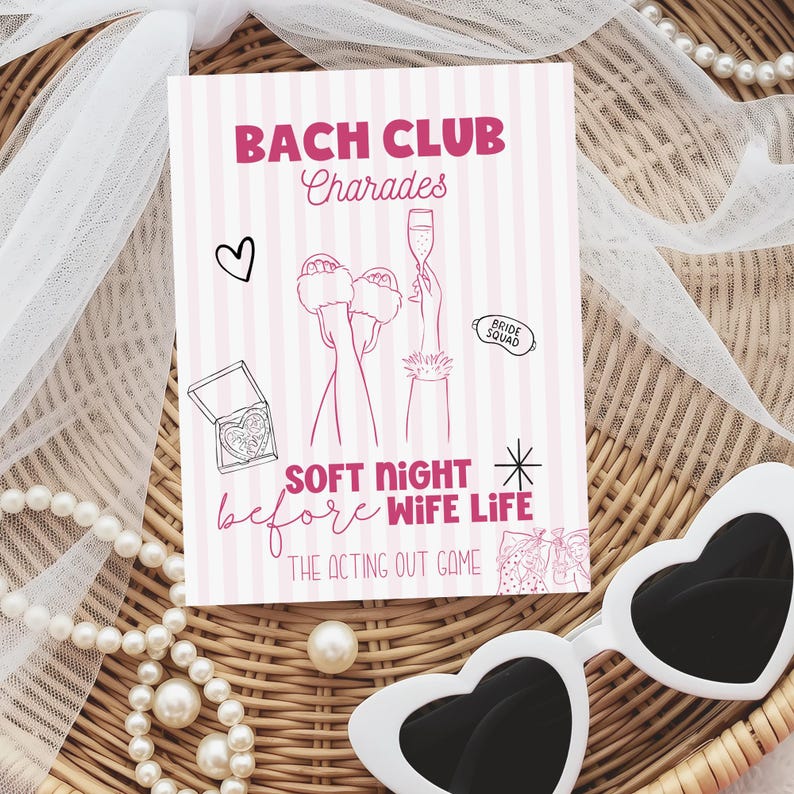 May include: A pink and white striped card with the text "BACH CLUB Charades" and illustrations of a heart, champagne, and slippers. The card also reads "SOFT NIGHT before WIFE LIFE" and "THE ACTING OUT GAME". A pair of white heart-shaped sunglasses and a pearl necklace are in the image.