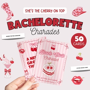 May include: A pink and white Bachelorette Charades game set with cherry and bow illustrations. The game includes 50 cards and features phrases like "Drunk Texting Someone" and "Crying During Vows".