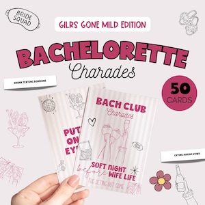 May include: A pink and white bachelorette party game set titled "Bachelorette Charades." The game includes 50 cards and features illustrations of cocktails, a disco ball, and text like "Drunk Texting Someone."