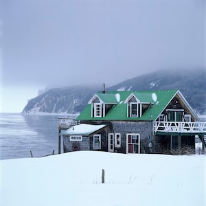 Chalet at Auberge-Coin-du-Banc and a winter fog over Cannes-de-Roches and the Three-Sisters at Percé