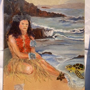 May include: A painting of a woman wearing a flower crown and a red lei sitting on a beach with a sea turtle swimming in the water. The background is a rocky coastline and a blue ocean.