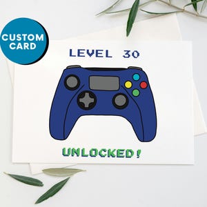 Puede incluir: Una tarjeta de cumpleaños con un mando de videojuegos azul y el texto "NIVEL 30 DESBLOQUEADO!"