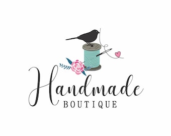 May include: Logo for a handmade boutique featuring a black bird perched atop a teal spool of thread with a needle and pink heart. Pink and blue floral accents surround the spool. The words "Handmade Boutique" are written in elegant script.