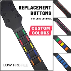 May include: Black guitar controller with replacement buttons in various colours. The image includes text that reads "REPLACEMENT BUTTONS FOR CRKD LES PAUL CUSTOM COLOURS LOW PROFILE."