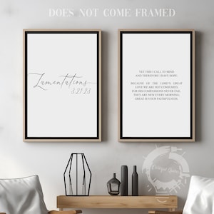 May include: Two framed wall art prints with black text on a white background. One print says "Lamentations 3:21-23" in a script font. The other print has a longer passage. The frames are black with a gold border. The text "DOES NOT COME FRAMED" is at the top.
